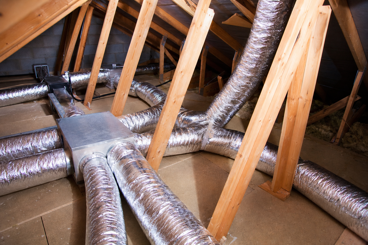 Illustration of insulated ventilation ductwork in a loft space