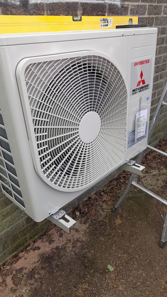Professional Mitsubishi air conditioning outdoor unit installation by Starr Engineering