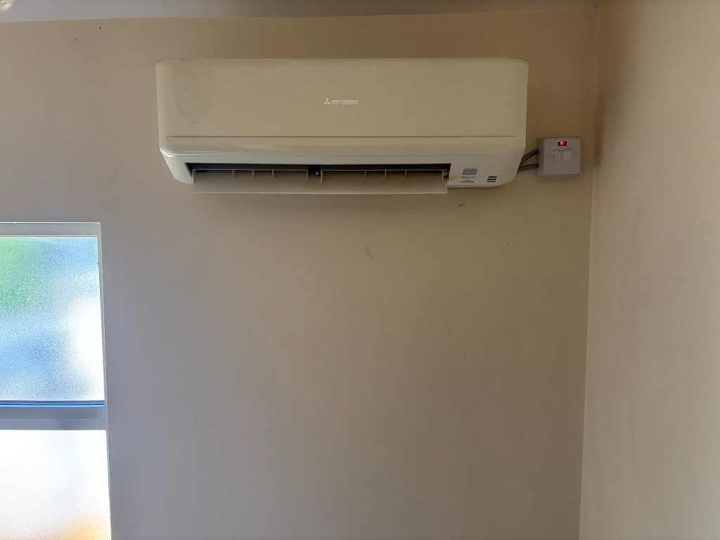 Indoor air conditioning unit with electrical isolator switch installed